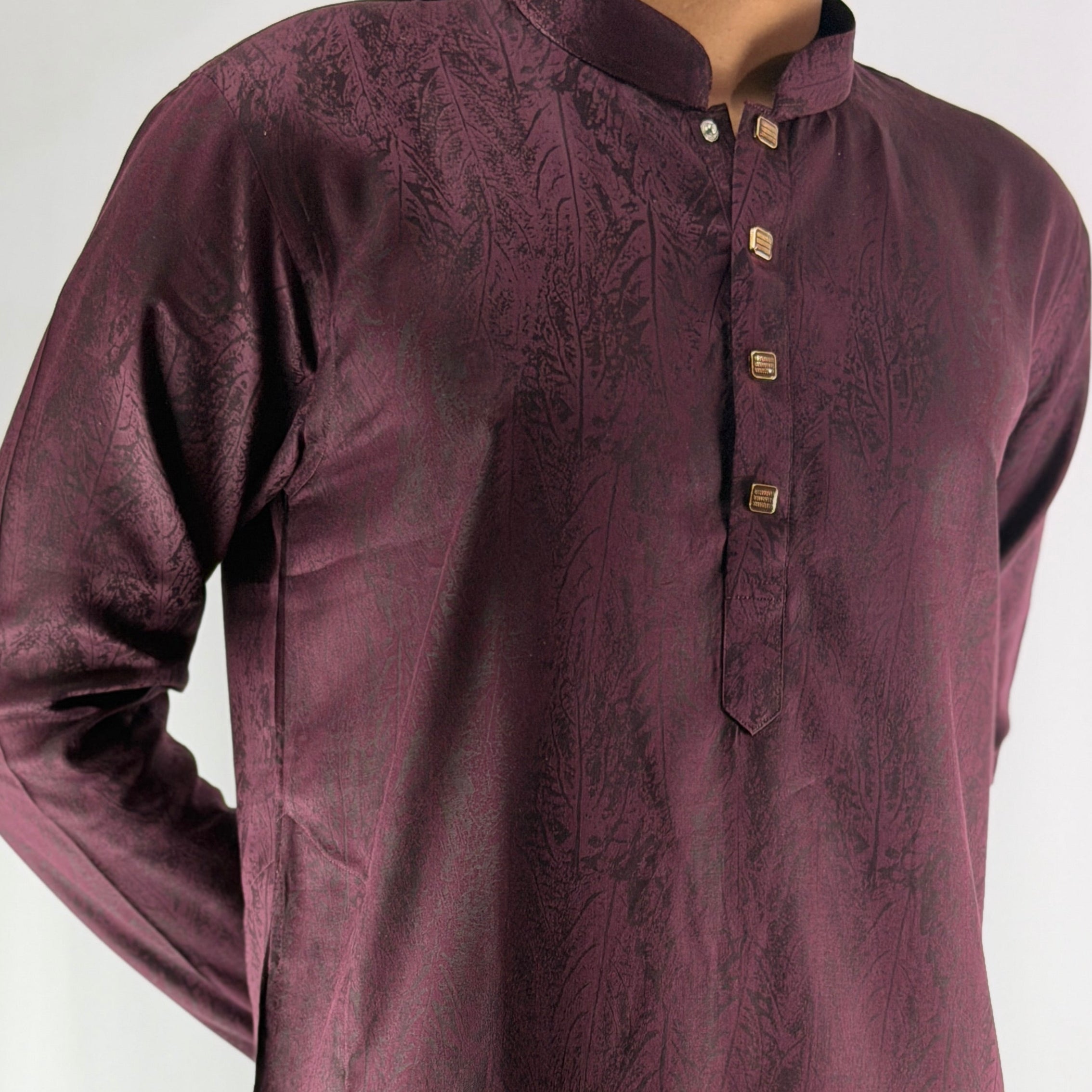 Mauve kurta with intricate patterns on a white background